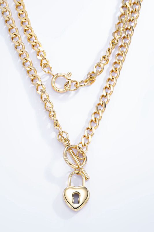 Collier ÉTERNIA – Double chaîne dorée avec pendentif cadenas cœur